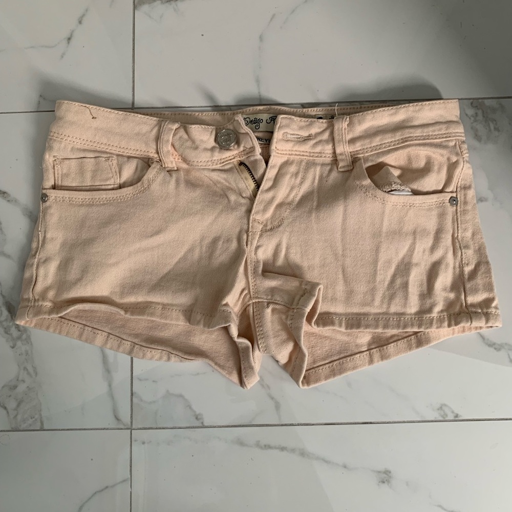 Peach colored jean shorts